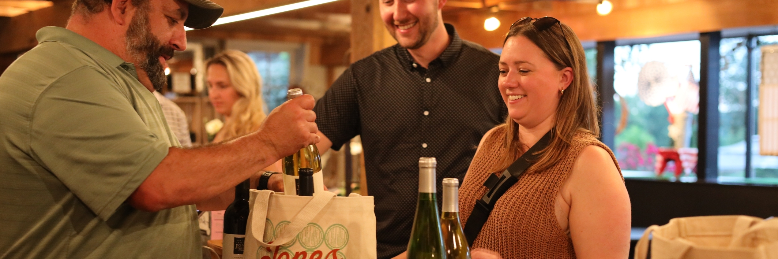 Guest with wine bottles at register