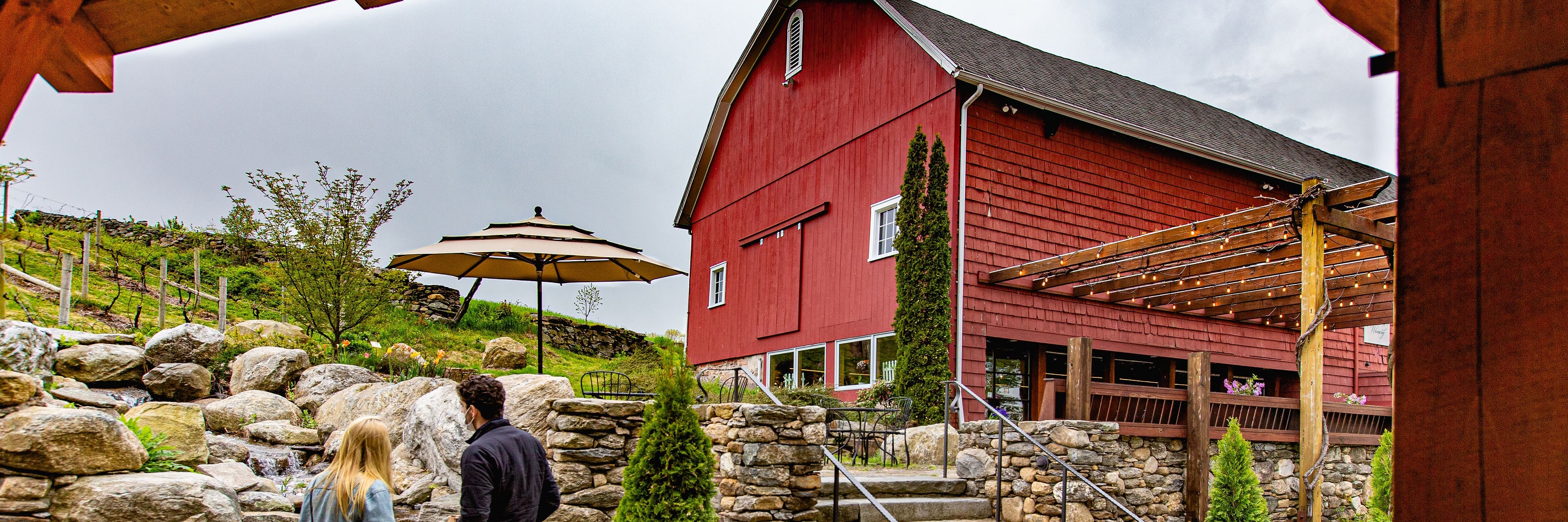 Winery, stone steps, couple standing by water fall