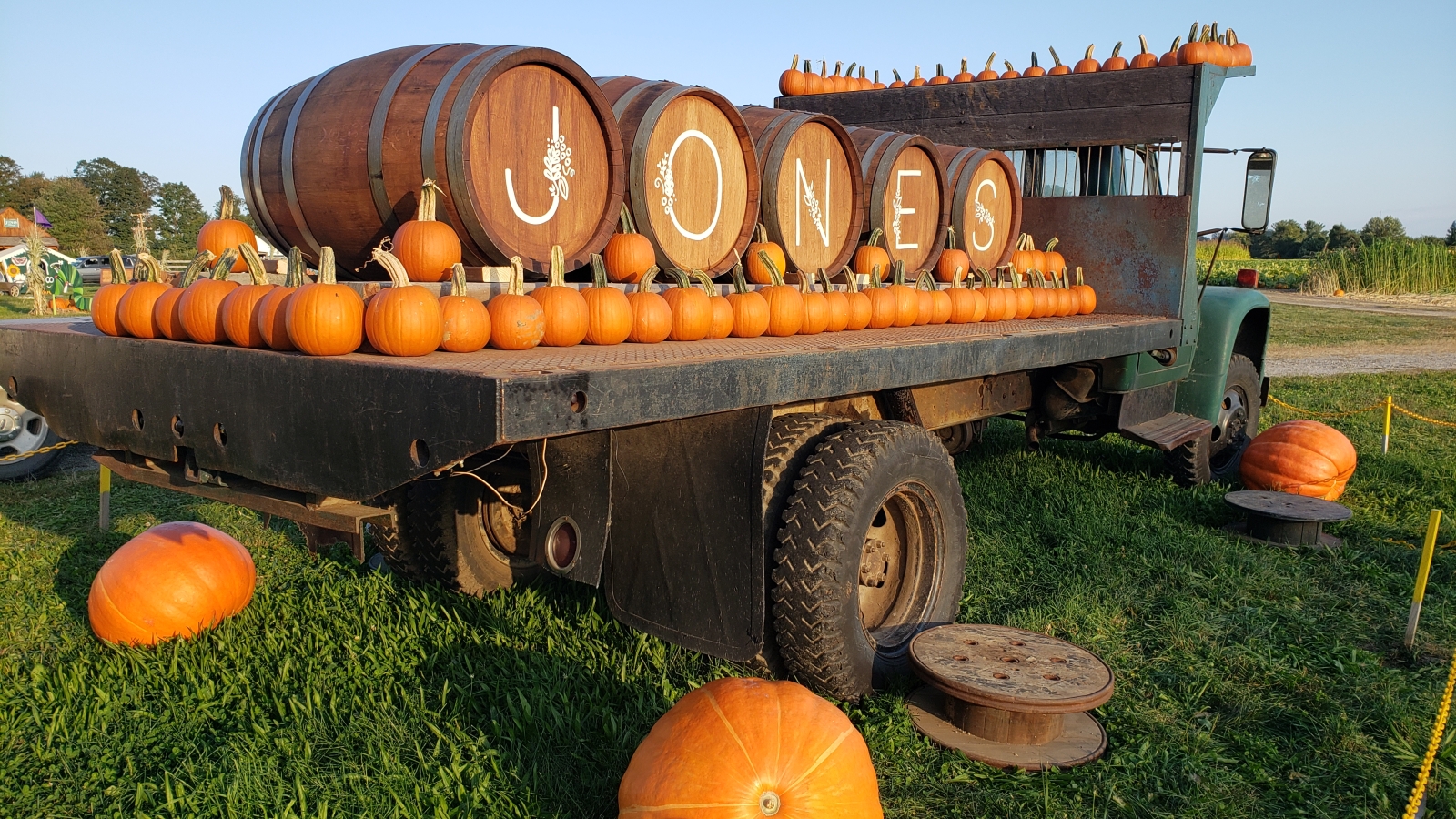 Kegs spell J-O-N-E-S on back of truck with pumpkins