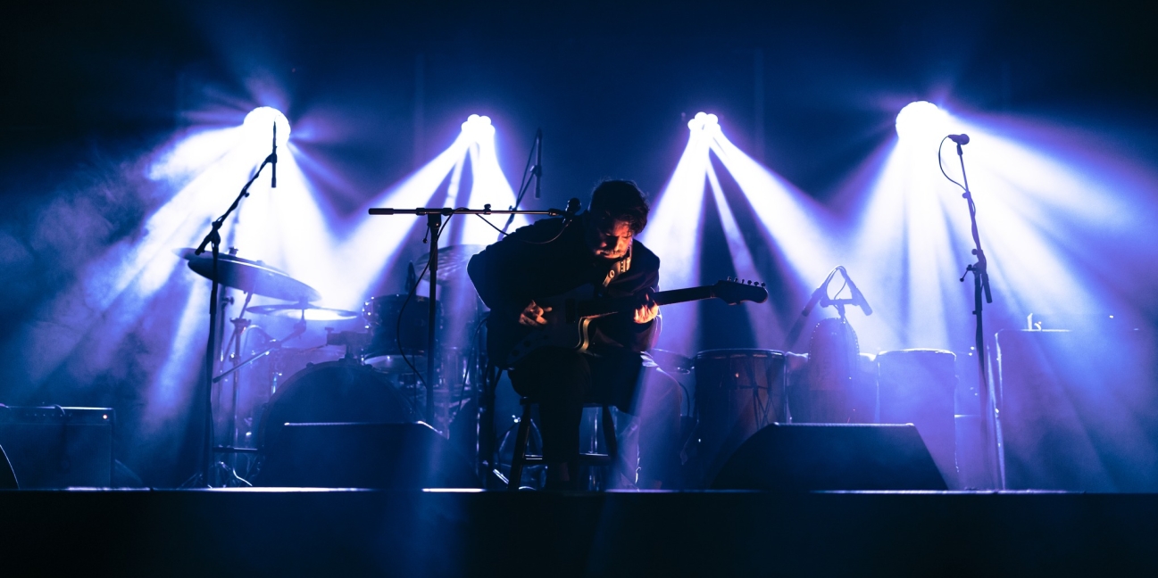 Chris Cavaliere on stage under the lights