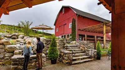 Winery, stone steps, couple standing by water fall