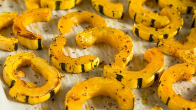 Roasted Delicata Squash with White Beans, Greens, and Sage on a platter