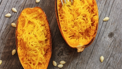 Roasted Spaghetti Squash with Herbs on a wooden table