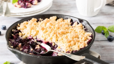 Blueberry Apple Crisp served in a cast iron pan