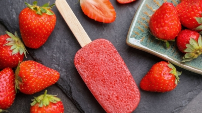 Strawberry Pops on the counter with fresh strawberries