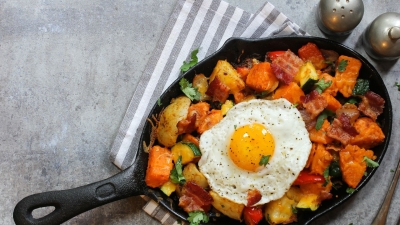 hash in a pan with a fried egg on top