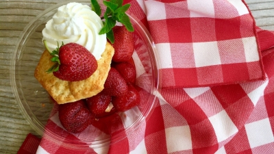 plated Strawberry Shortcake on a red and white checked cloth napkin