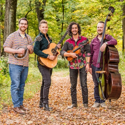 Charlie Widemer Band in the woods with their instruments