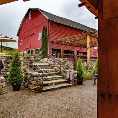 Winery, stone steps, couple standing by water fall