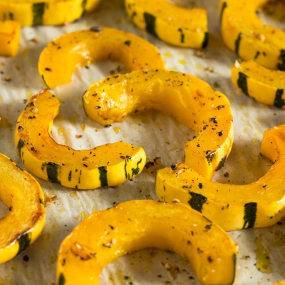 Roasted Delicata Squash with White Beans, Greens, and Sage on a platter