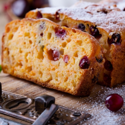 sliced Pumpkin Cranberry Tea Bread on a cutting board