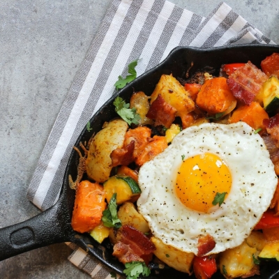 hash in a pan with a fried egg on top